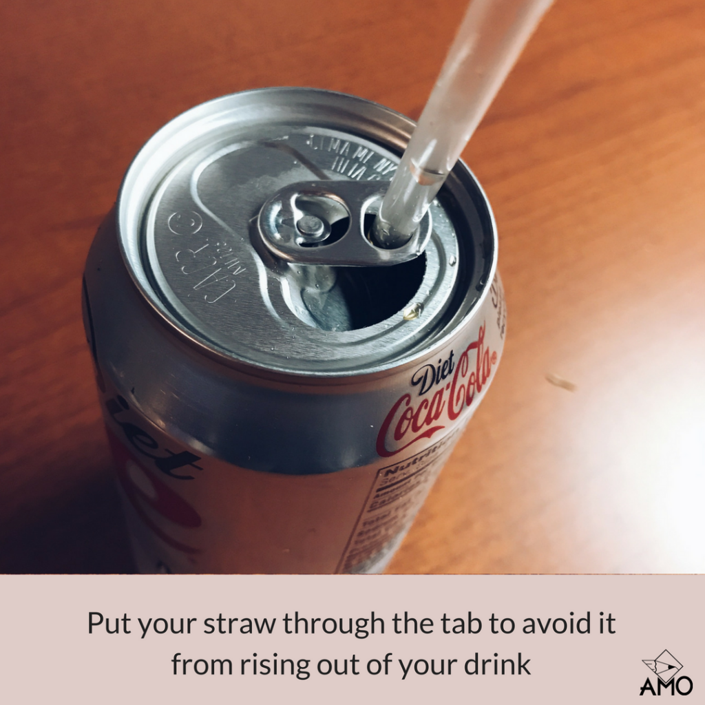 Image of Put a straw through the tab of a can to avoid it from rising out of your drink