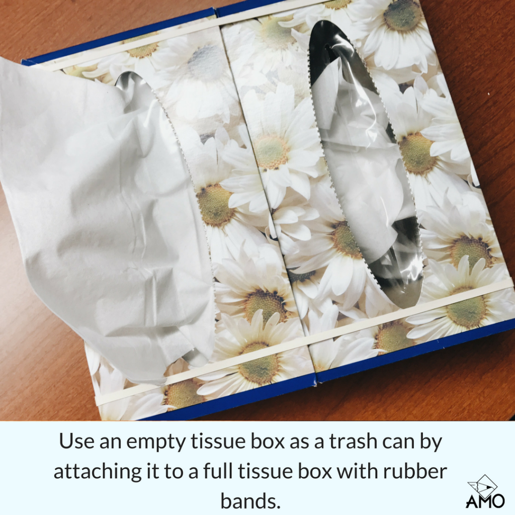 Image of Use an empty tissue box as a trash bin by attaching it to a full tissue box with rubber bands